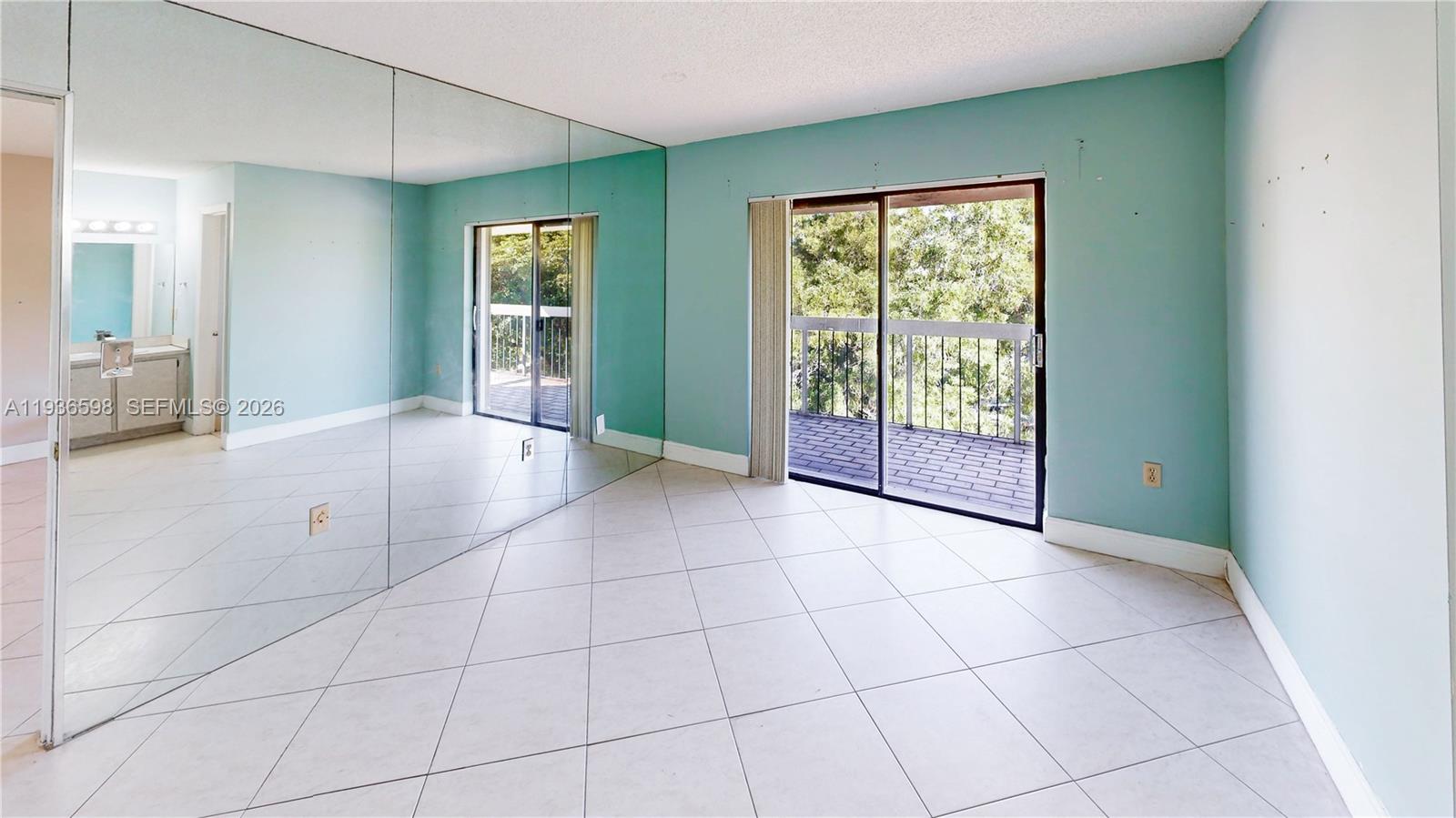 Modern kitchen with designer features at 1300 122nd Ave - Condo in Miami