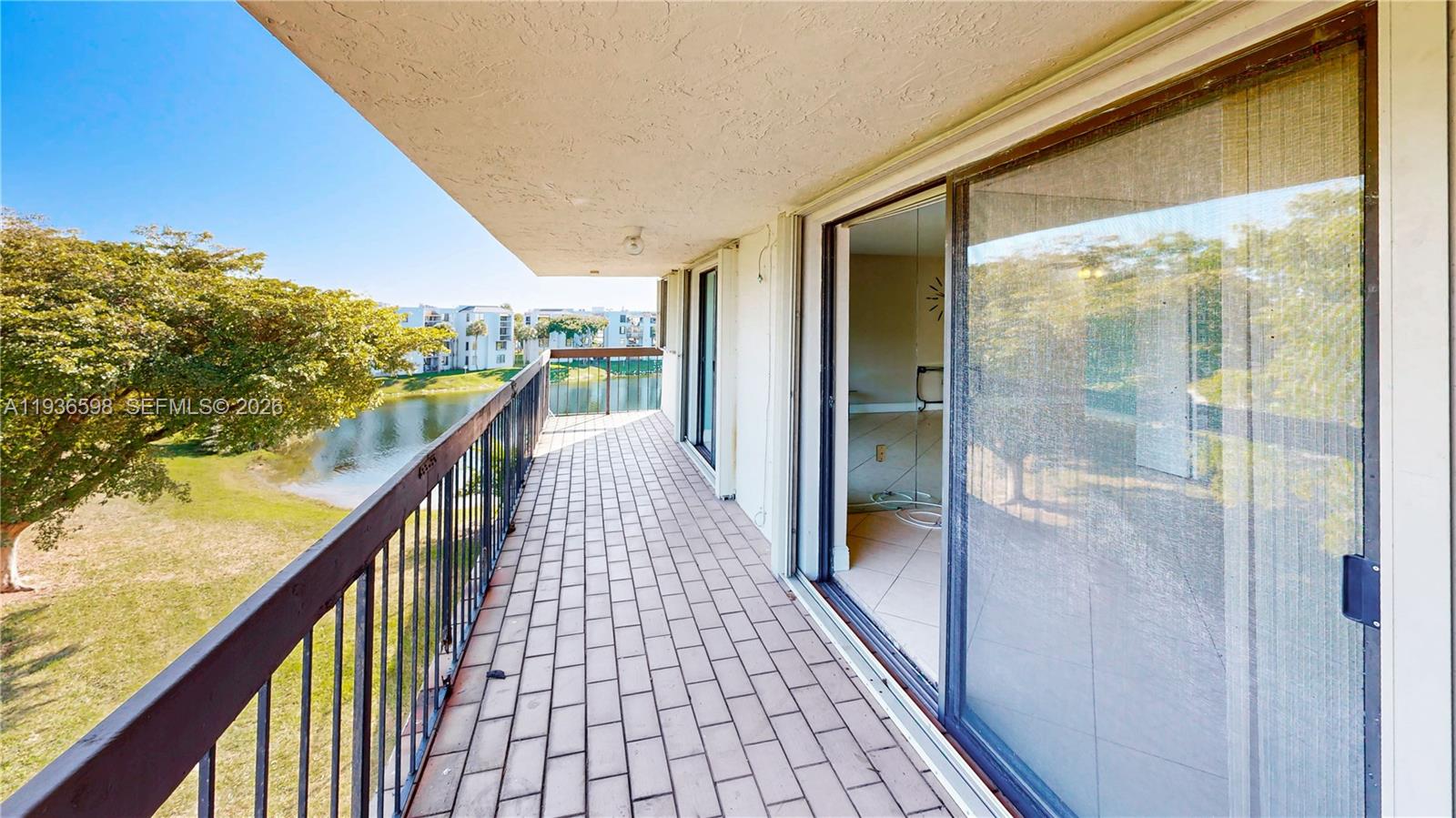 Spacious living room with panoramic views at 1300 122nd Ave - Condo in Miami