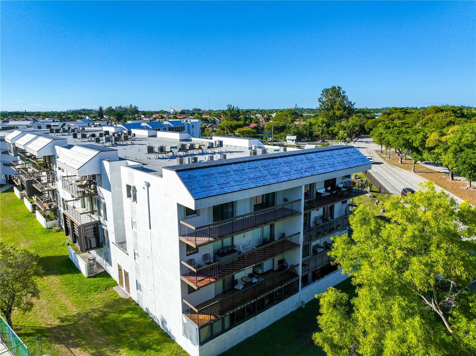 Spacious living room with panoramic views at 1300 122nd Ave - Condo in Miami
