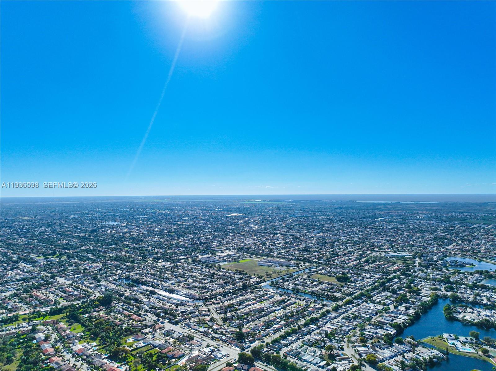 Spacious living room with panoramic views at 1300 122nd Ave - Condo in Miami