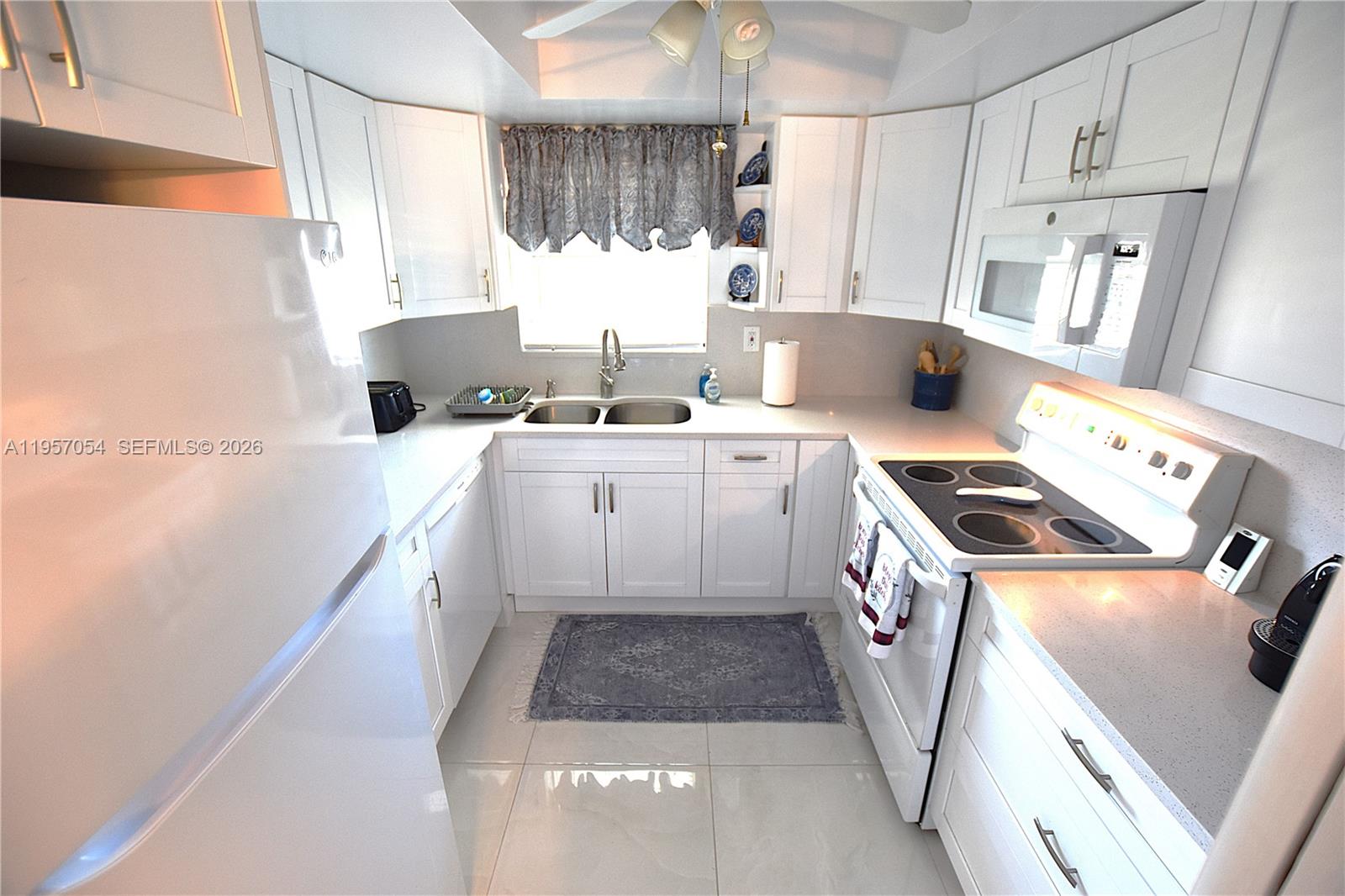 Modern kitchen with designer features at 2750 Emory Dr East - Condo in West Palm Beach