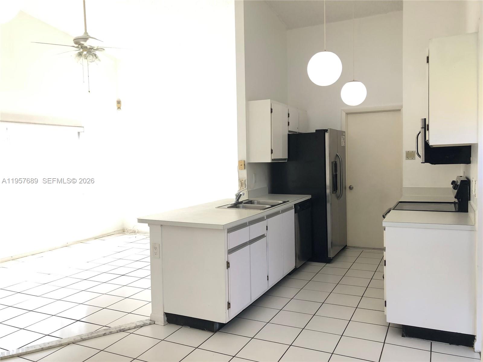 Open-concept living area at 719 3rd Ave - Home in Dania Beach