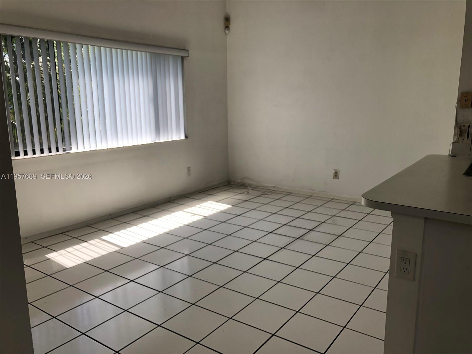 Modern kitchen with designer features at 719 3rd Ave - Home in Dania Beach