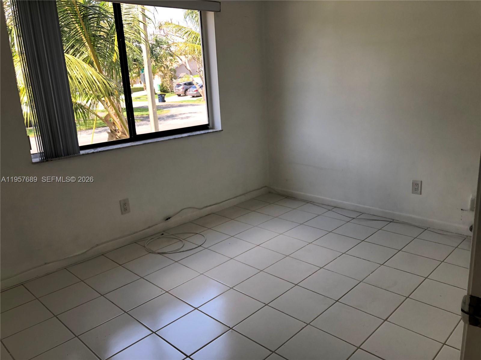 Well-appointed guest bedroom at 719 3rd Ave - Home in Dania Beach