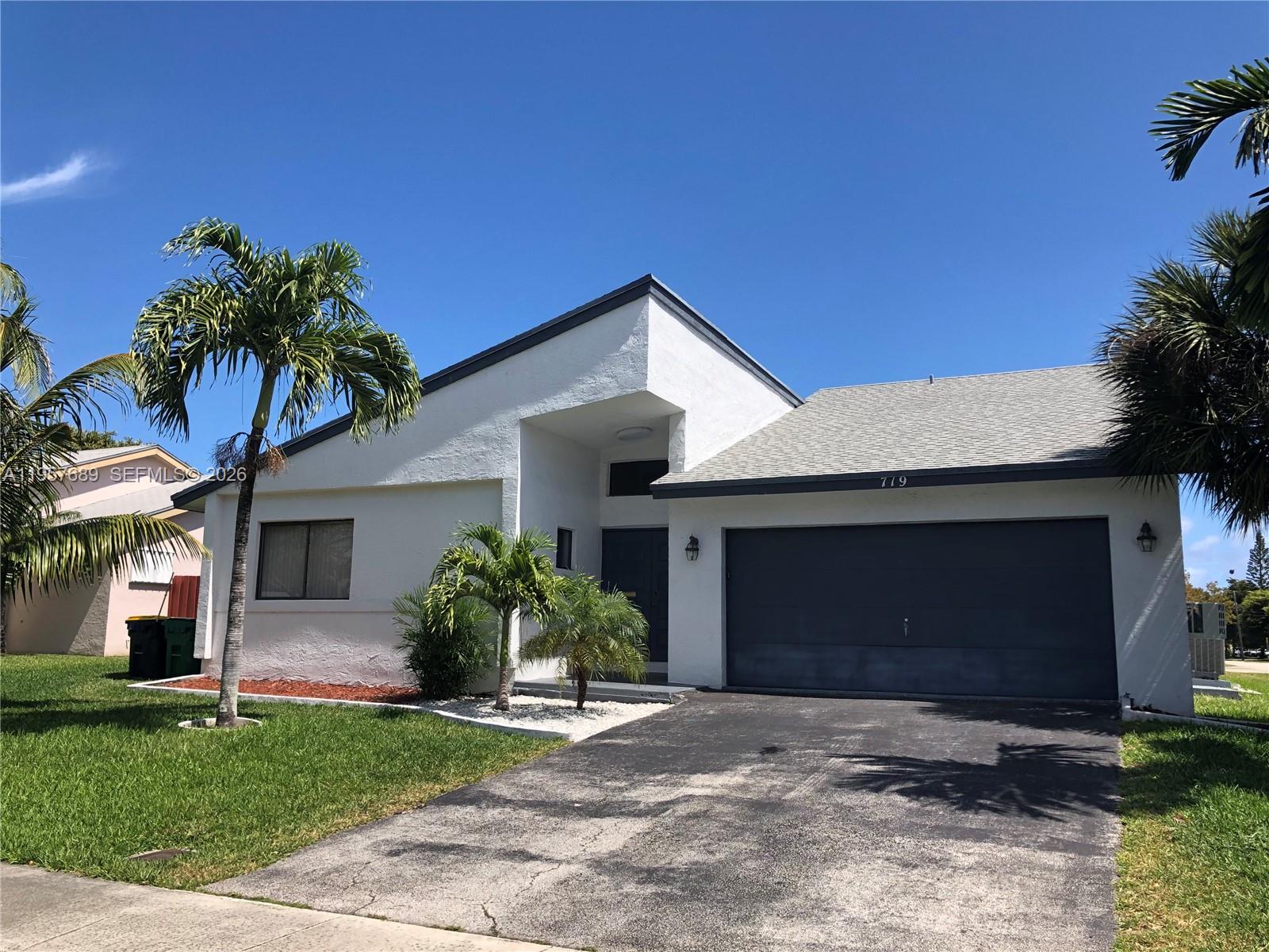 Open-concept living area at 719 3rd Ave - Home in Dania Beach