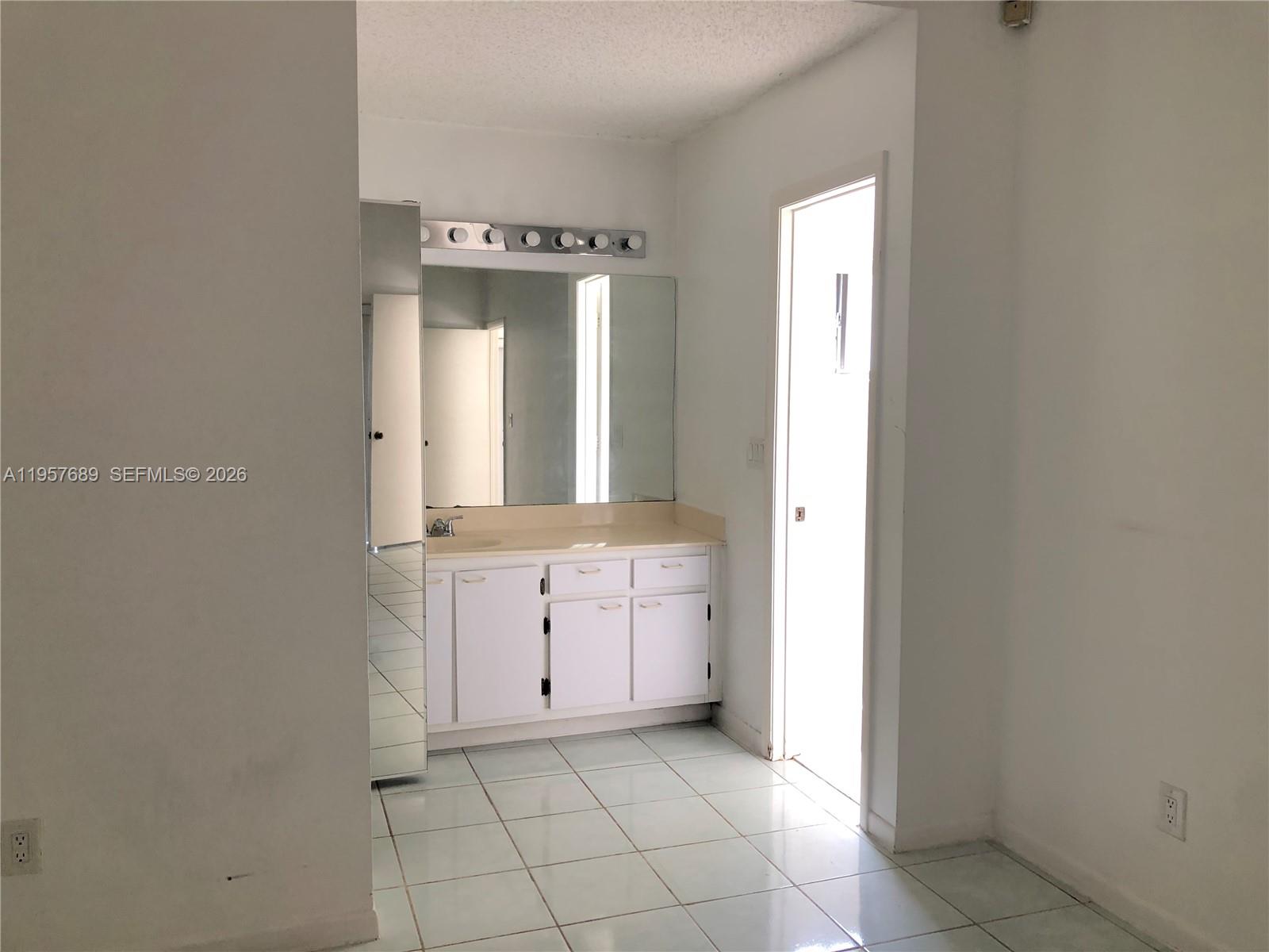 Modern kitchen with designer features at 719 3rd Ave - Home in Dania Beach