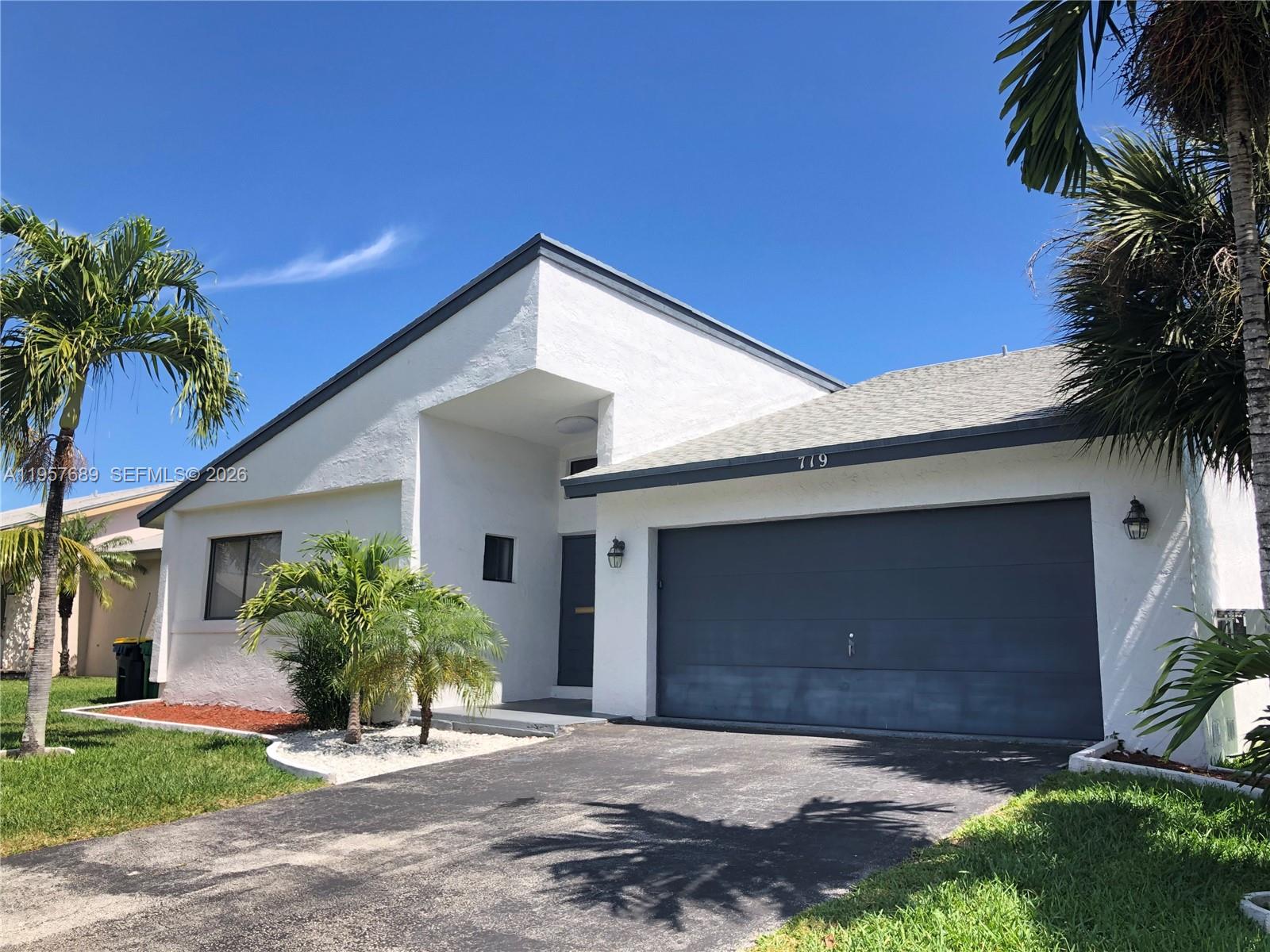 Open-concept living area at 719 3rd Ave - Home in Dania Beach