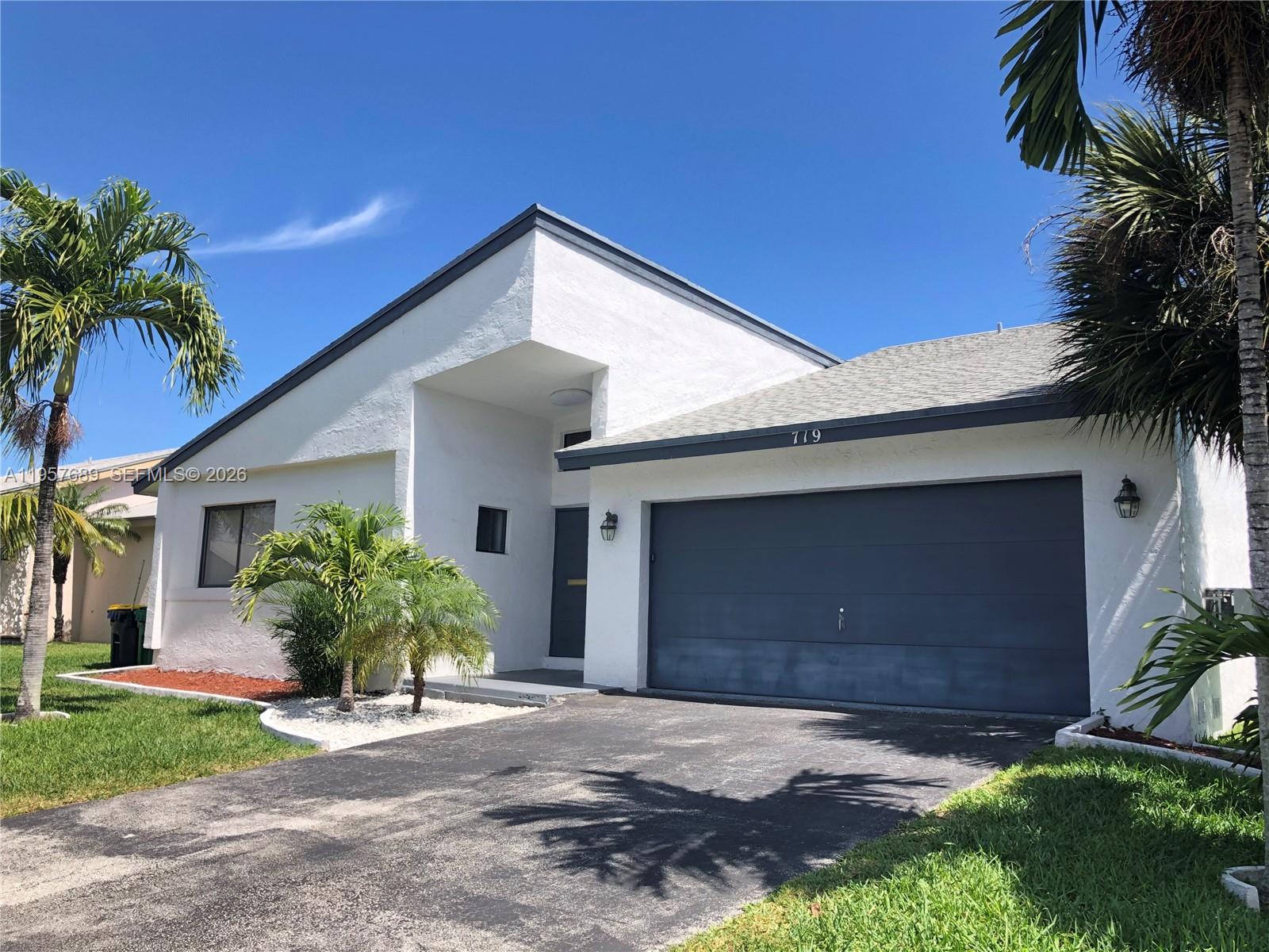 Modern kitchen with designer features at 719 3rd Ave - Home in Dania Beach