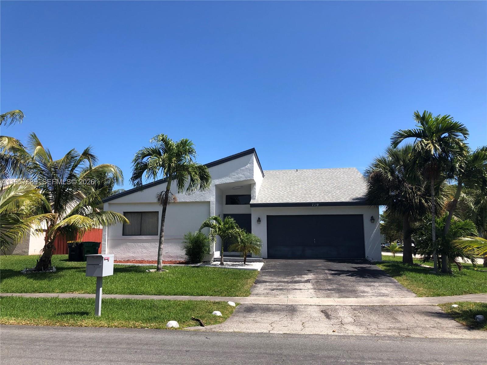 Modern kitchen with designer features at 719 3rd Ave - Home in Dania Beach