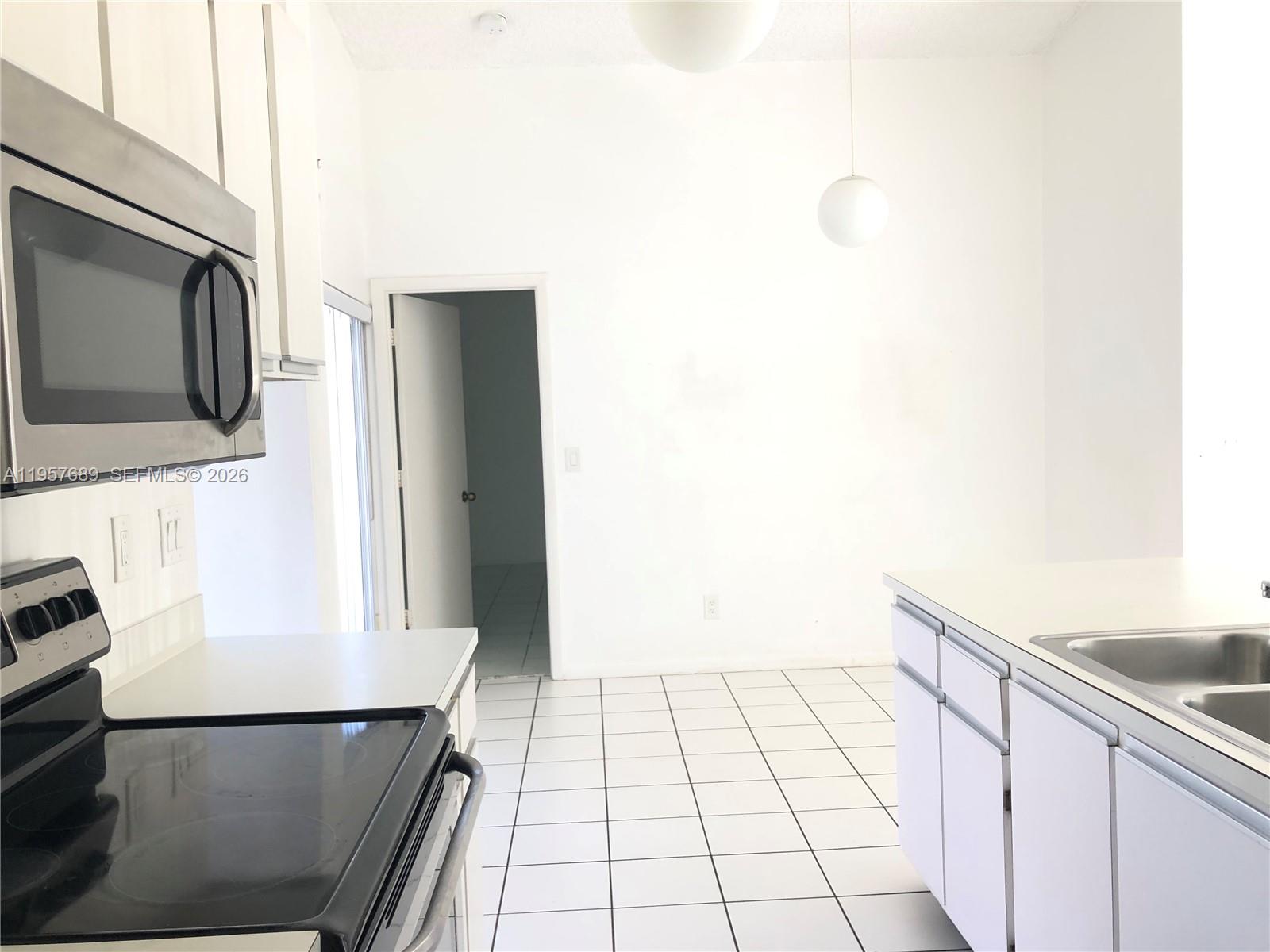 Well-appointed guest bedroom at 719 3rd Ave - Home in Dania Beach