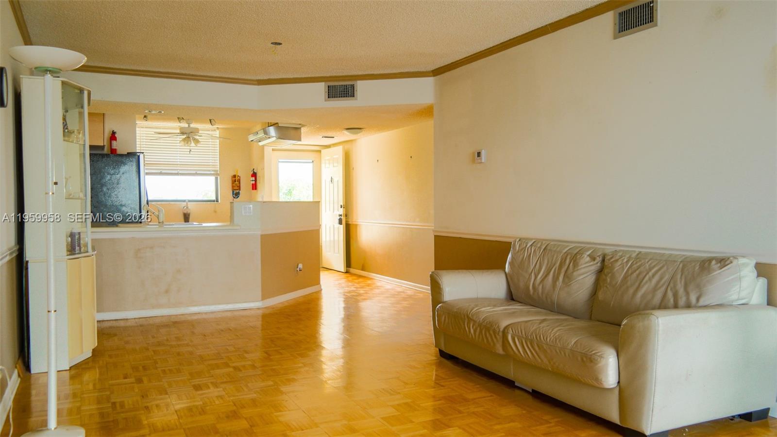 Spacious living room with panoramic views at 116 Lake Emerald Dr - Condo in Oakland Park