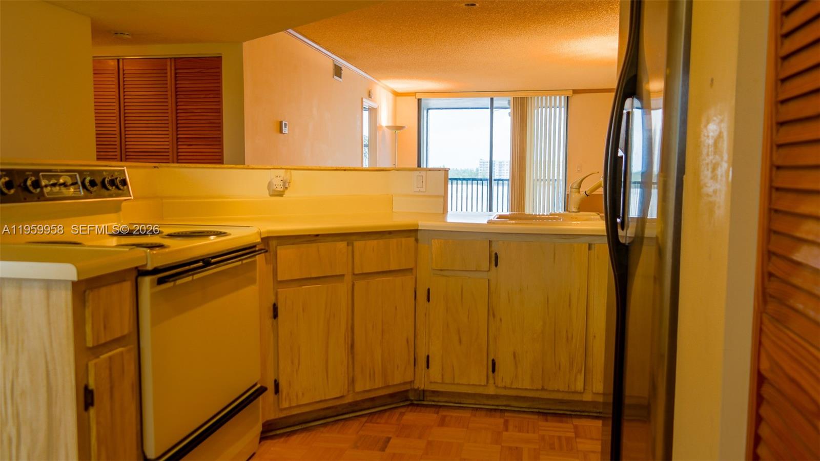 Spacious living room with panoramic views at 116 Lake Emerald Dr - Condo in Oakland Park