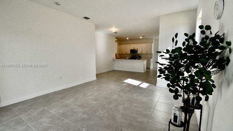 Well-appointed guest bedroom at 4949 Peacock Way - Townhouse in Dania Beach