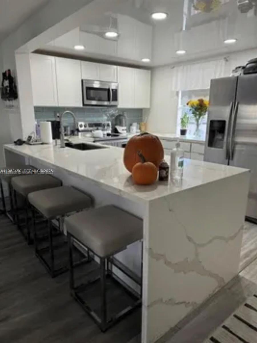 Open-concept living area at 301 3rd St - Condo in Dania Beach