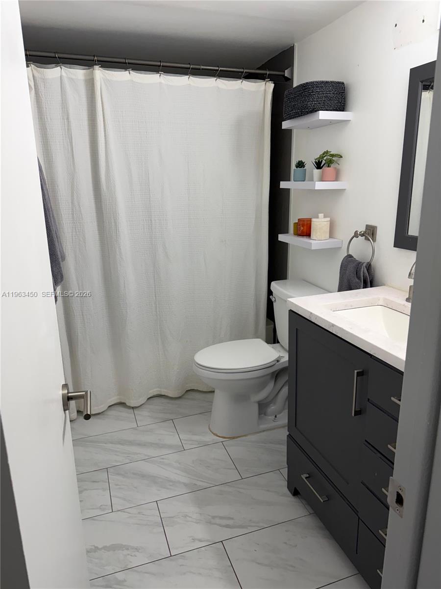 Designer master bathroom at 301 3rd St - Condo in Dania Beach