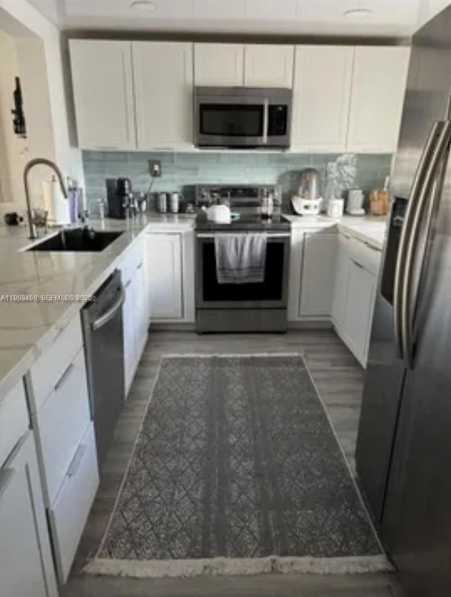 Well-appointed guest bedroom at 301 3rd St - Condo in Dania Beach