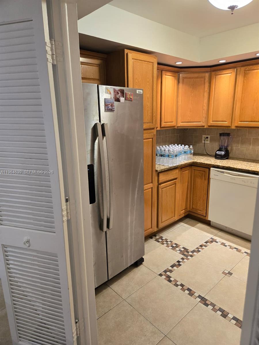 Well-appointed guest bedroom at 4156 Inverrary Dr - Condo in Lauderhill