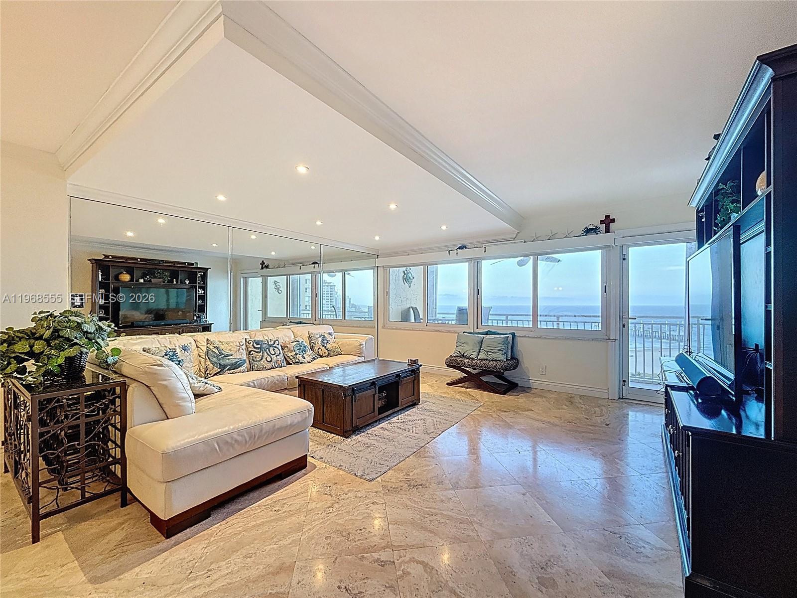 Spacious living room with panoramic views at 328 Ocean Blvd - Condo in Pompano Beach