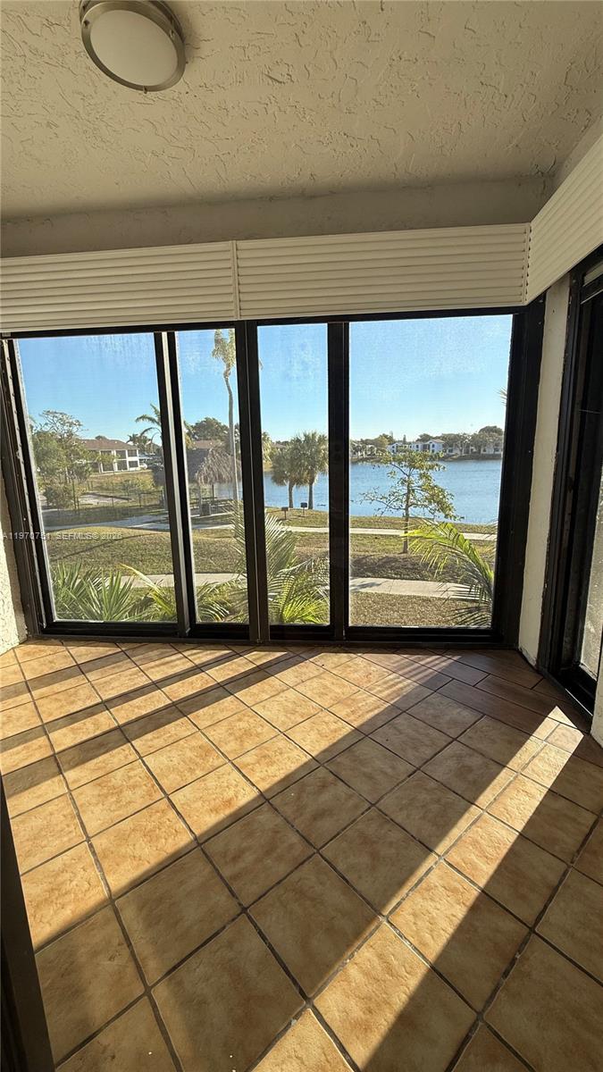 Well-appointed guest bedroom at 201 Lake Pointe Dr - Condo in Oakland Park