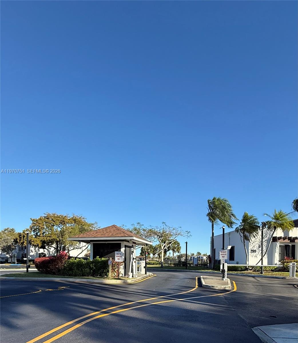 Spacious living room with panoramic views at 201 Lake Pointe Dr - Condo in Oakland Park