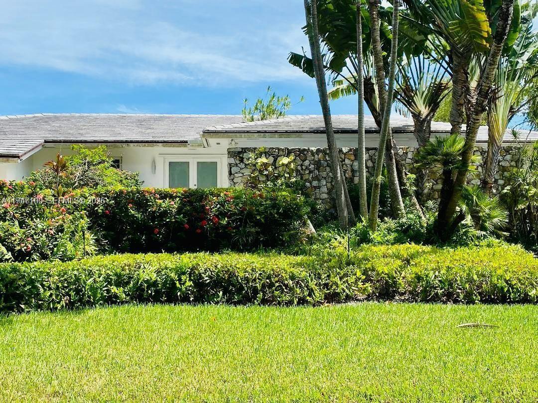 This beautiful house sits on an elevated lot in prestigious Gables by the sea. It features modern finishes, an updated kitchen w/ quartz countertop, 4 spacious bedrooms (2 en-suites), a home theater/den that can double as a 5th bedroom, and 3.5 bathrooms. Enjoy the safety and tranquility provided by impact windows and doors, covered outdoor area, a large 2 car garage and more. The private designer dock and seawall offer the perfect spot to witness breathtaking sunrises and sunsets. As night falls, the underwater lighting turns your dock into a mesmerizing display, showcasing the marine life and creating the ambiance of your own personal aquarium. Located near top-rated A+ schools. Contact owner/agent for showings. *No ocean access*
