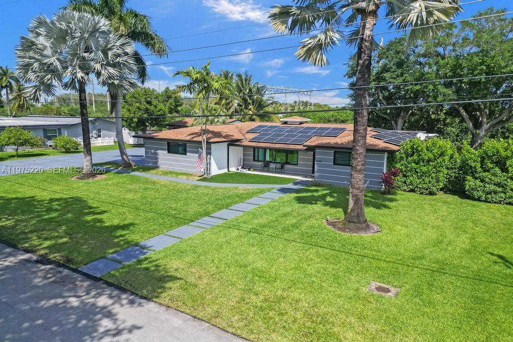 Modern kitchen with designer features at 4660 37th Ave - Home in Dania Beach