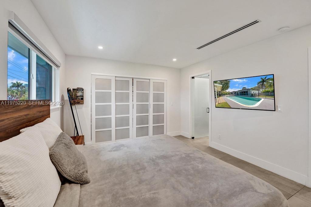 Well-appointed guest bedroom at 4660 37th Ave - Home in Dania Beach