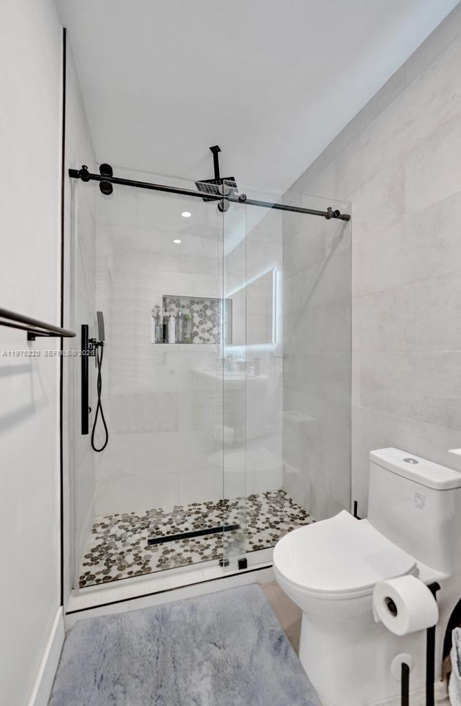 Well-appointed guest bedroom at 4660 37th Ave - Home in Dania Beach