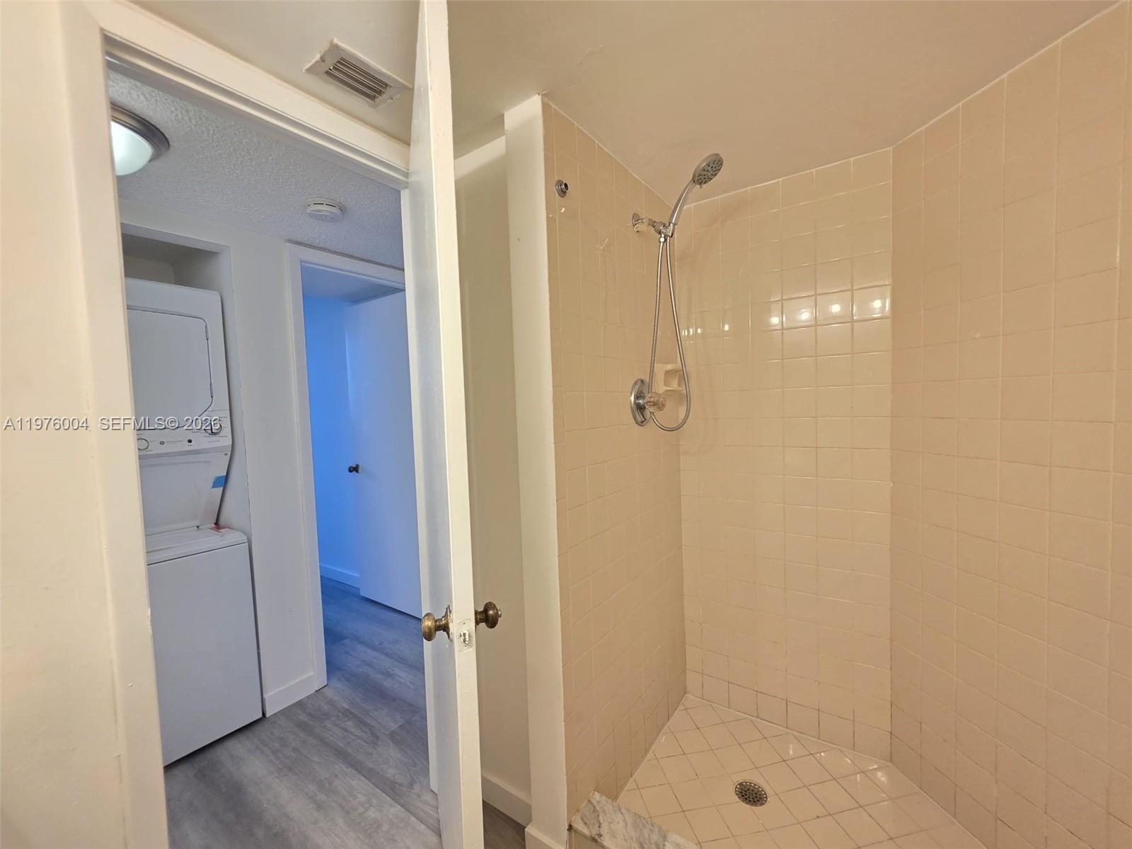 Modern kitchen with designer features at 210 Lake Pointe Dr - Condo in Oakland Park