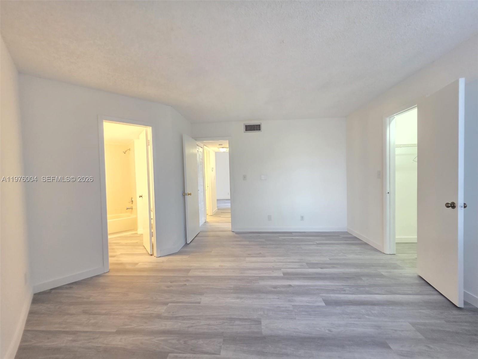 Elegant master bedroom retreat at 210 Lake Pointe Dr - Condo in Oakland Park