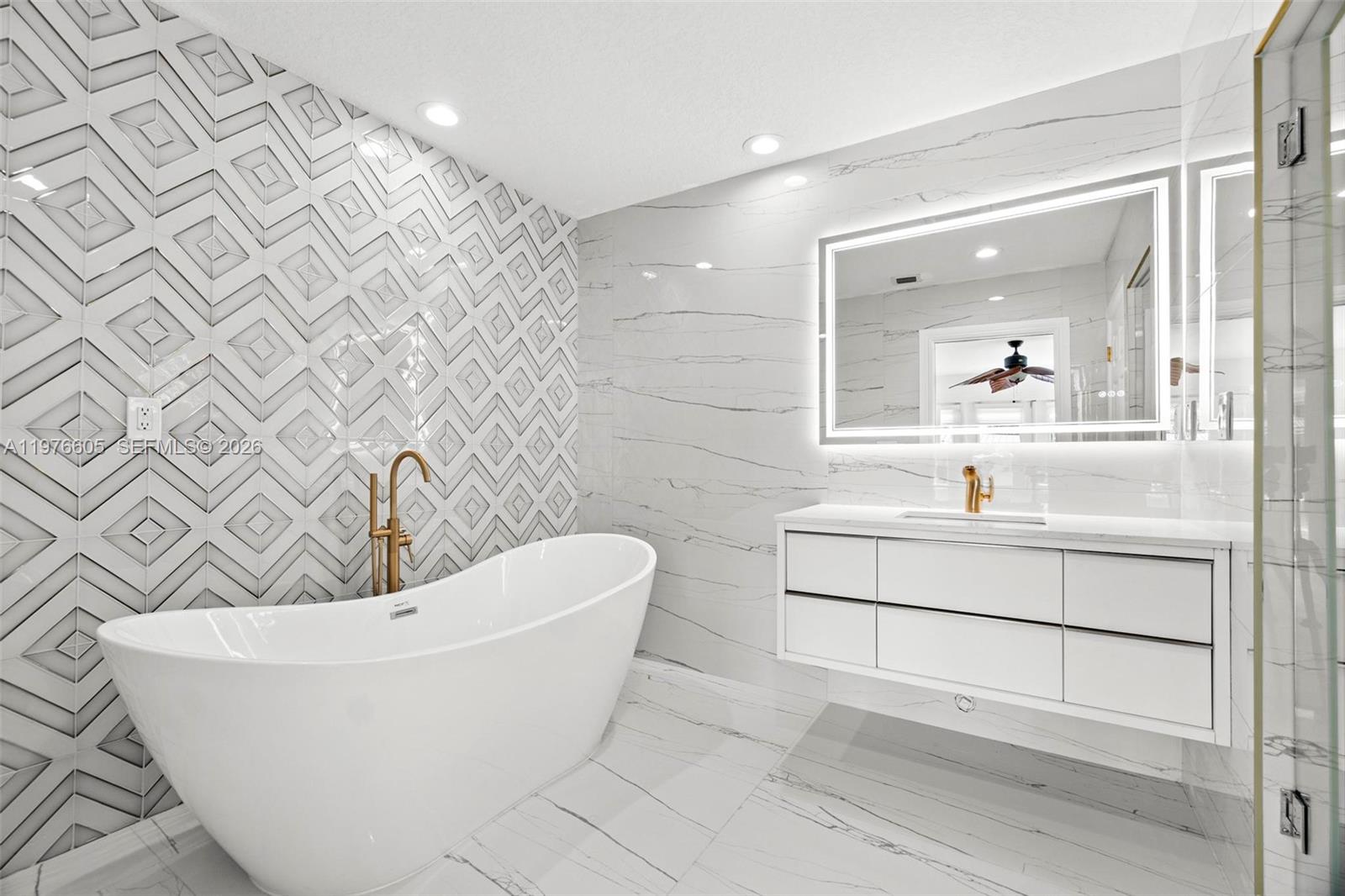 Modern kitchen with designer features at 947 Nautilus Isle - Home in Dania Beach