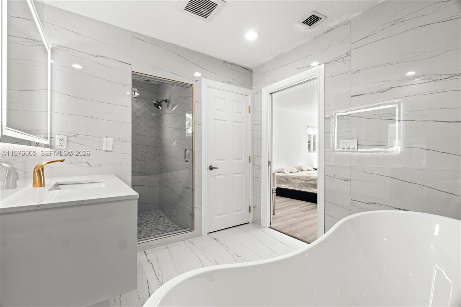 Elegant master bedroom retreat at 947 Nautilus Isle - Home in Dania Beach