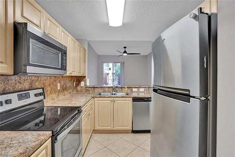 Modern kitchen with designer features at 2325 Mariner Ct - Townhouse in Dania Beach