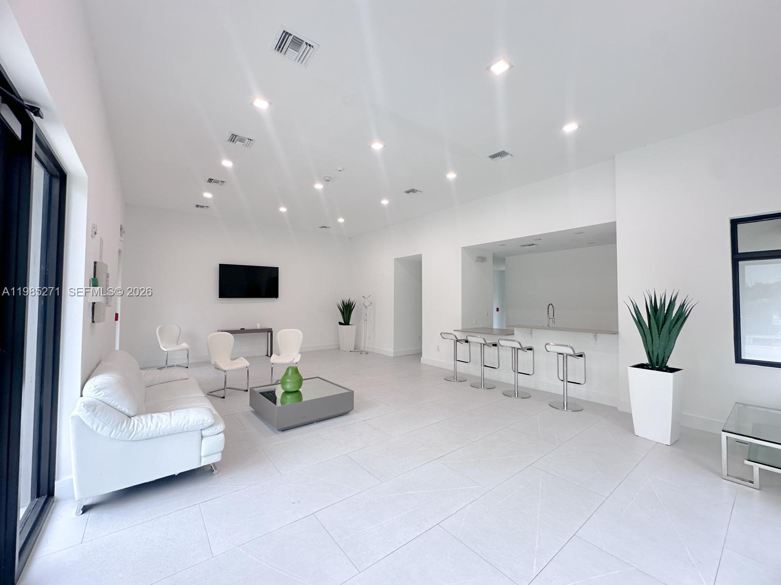 Modern kitchen with designer features at 5481 Oak Way - Townhouse in Dania Beach