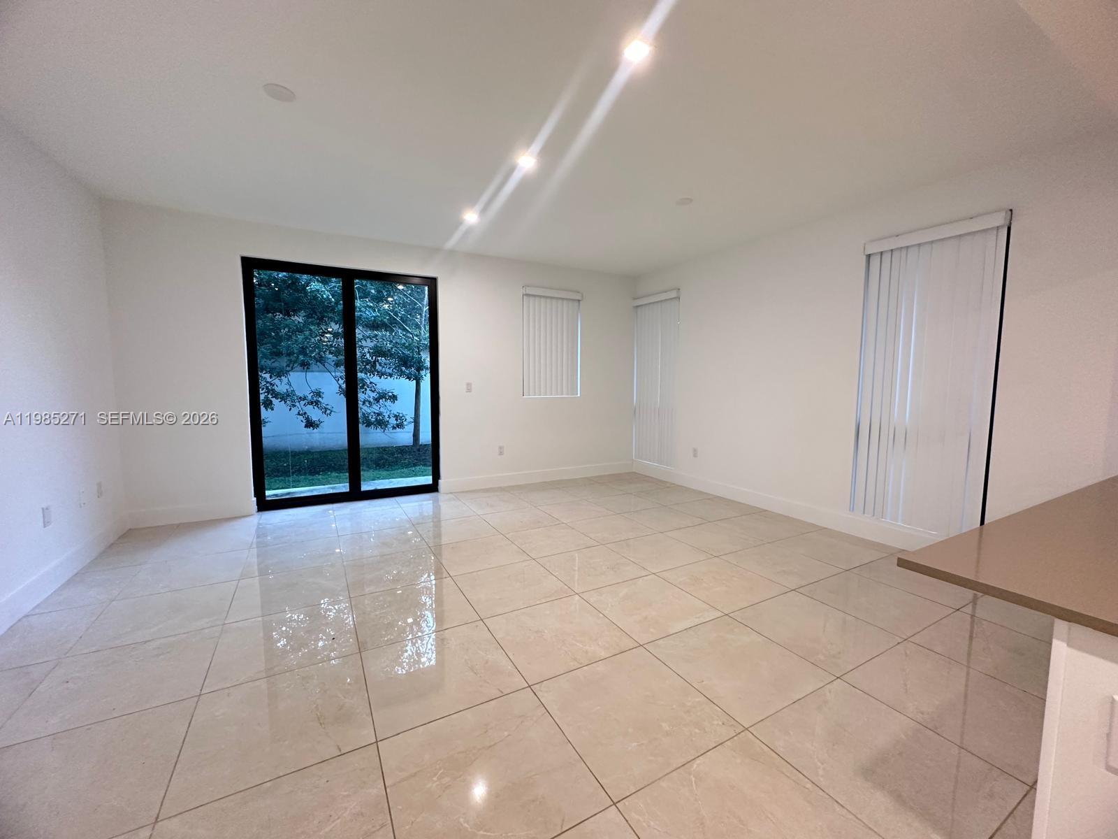 Well-appointed guest bedroom at 5481 Oak Way - Townhouse in Dania Beach