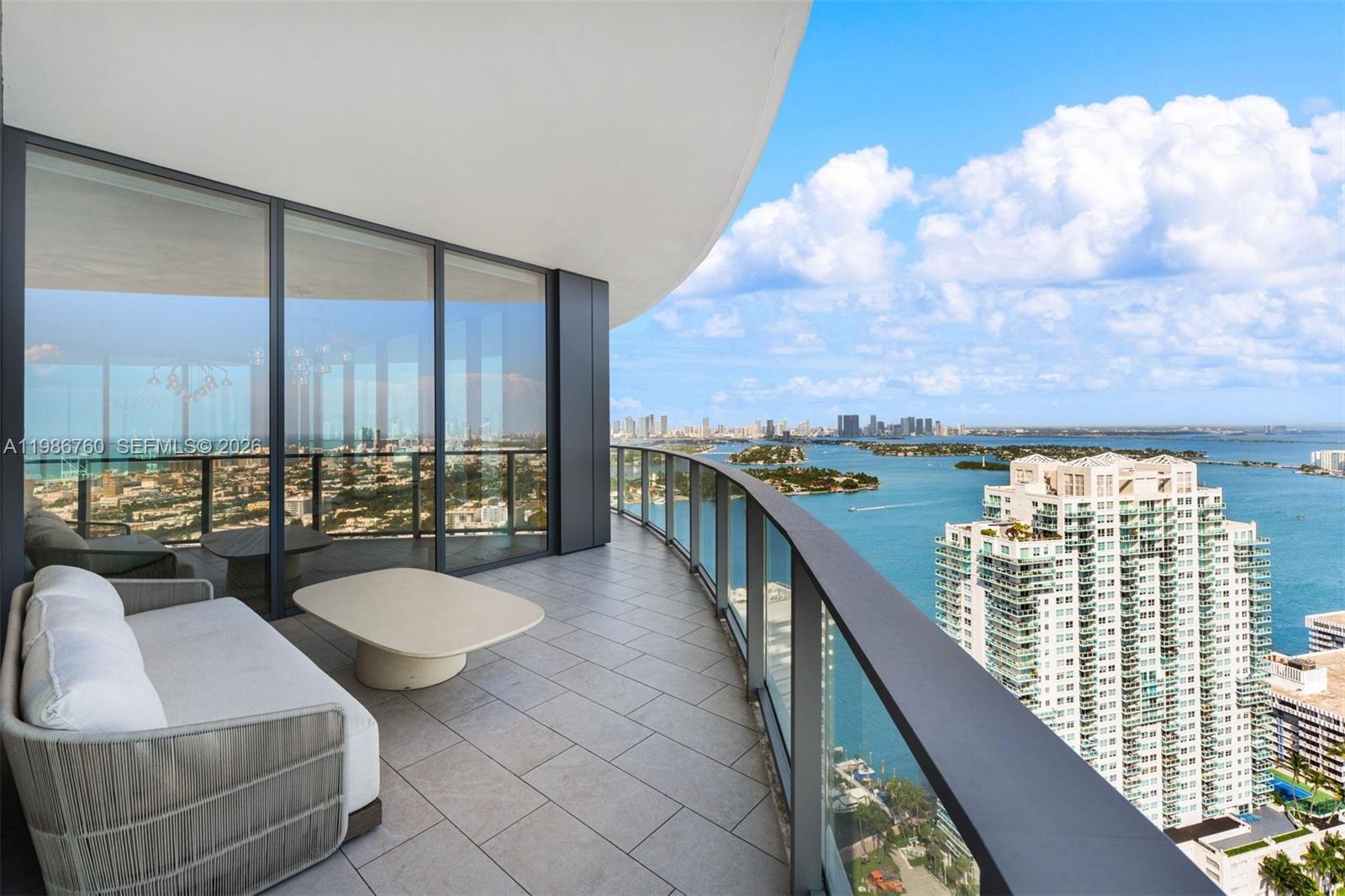 Experience unparalleled Miami Beach living in this 3-bed, 4.5-bath, 2,441 sq ft residence at Five Park by Arquitectonica. Flooded with natural light and framed by floor-to-ceiling glass, the home offers unprecedented bay and ocean views from every angle. Step onto the wraparound terrace, entertain in the chef’s kitchen with Gabellini Sheppard Italian oak cabinetry, Gaggenau appliances, marble countertops, and integrated wooden-top dining. This brand-new turnkey residence combines luxury, design, and sustainability. Residents enjoy full-service amenities including the 26th-floor CANOPY CLUB, concierge, private dining, bar and lounge, wellness areas, spa, and exclusive beach club access.