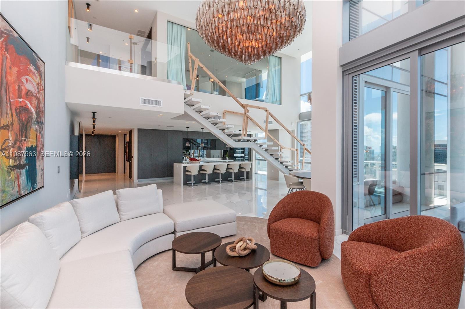 Discover Penthouse 4611, a 4,000 sq ft duplex sanctuary soaring above Downtown Miami, offering unparalleled sunrise-to-sunset panoramas over the Atlantic, Brickell and the city skyline. This 4-bedroom, 5.5-bath residence is fully turnkey, elegantly furnished with curated designer pieces from Artefacto and Modani, featuring sleek built-ins, frame TVs in every bedroom, smart Control4 automation and blackout shades for ultimate comfort and privacy.Every detail has been crafted for indulgence: spa-like bathrooms with luxurious finishes, a home theater-inspired living space and expansive living areas perfect for entertaining or relaxing in style. Step outside to experience resort-style living with multiple pools, a skydeck observatory, children’s playground, tennis and soccer courts, a full-service spa, state-of-the-art fitness center with boxing and yoga studios, golf simulator, game and recreation rooms and even a private recording studio. Penthouse 4611 isn’t just a home, it’s a sky-high lifestyle where design, luxury and breathtaking views come together in a fully curated, move-in-ready masterpiece.