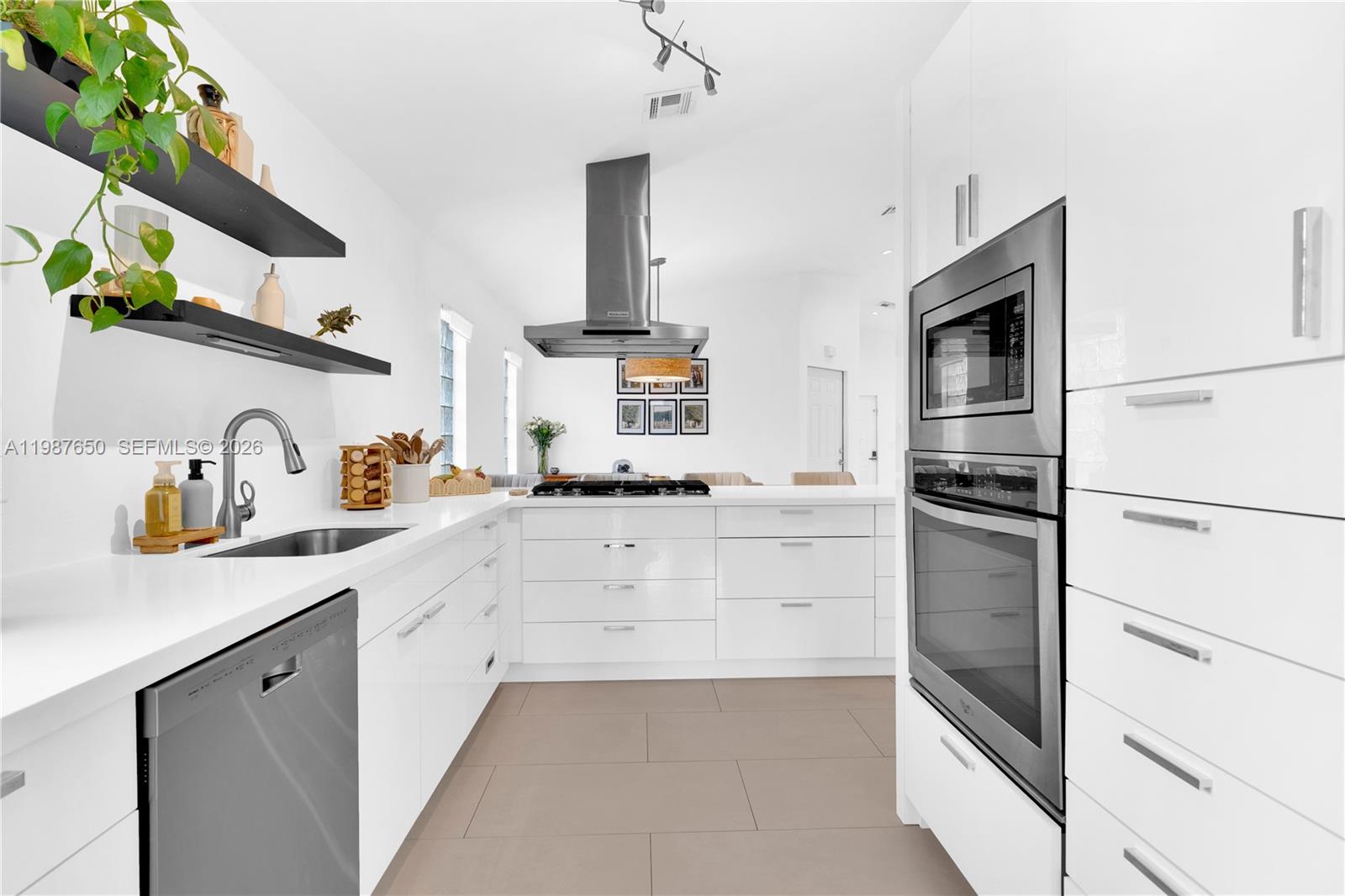 Welcome home to this beautifully remodeled, turnkey single-family residence located in the highly desirable Lakes by the Bay community in Cutler Bay. This 3-bedroom, 2-bathroom home features updated tile flooring throughout, along with a fully remodeled modern kitchen featuring sleek white quartz countertops and contemporary flat-panel cabinetry with a high-gloss finish and remodeled bathrooms that create a sleek and modern look. Equipped with impact windows and doors. Step outside to a private, fully fenced backyard perfect for relaxing or entertaining with ample space for future upgrades, including a pool or space for a boat. Conveniently located near top-rated schools, parks, shopping, and dining, with easy access to US-1 and the Turnpike.