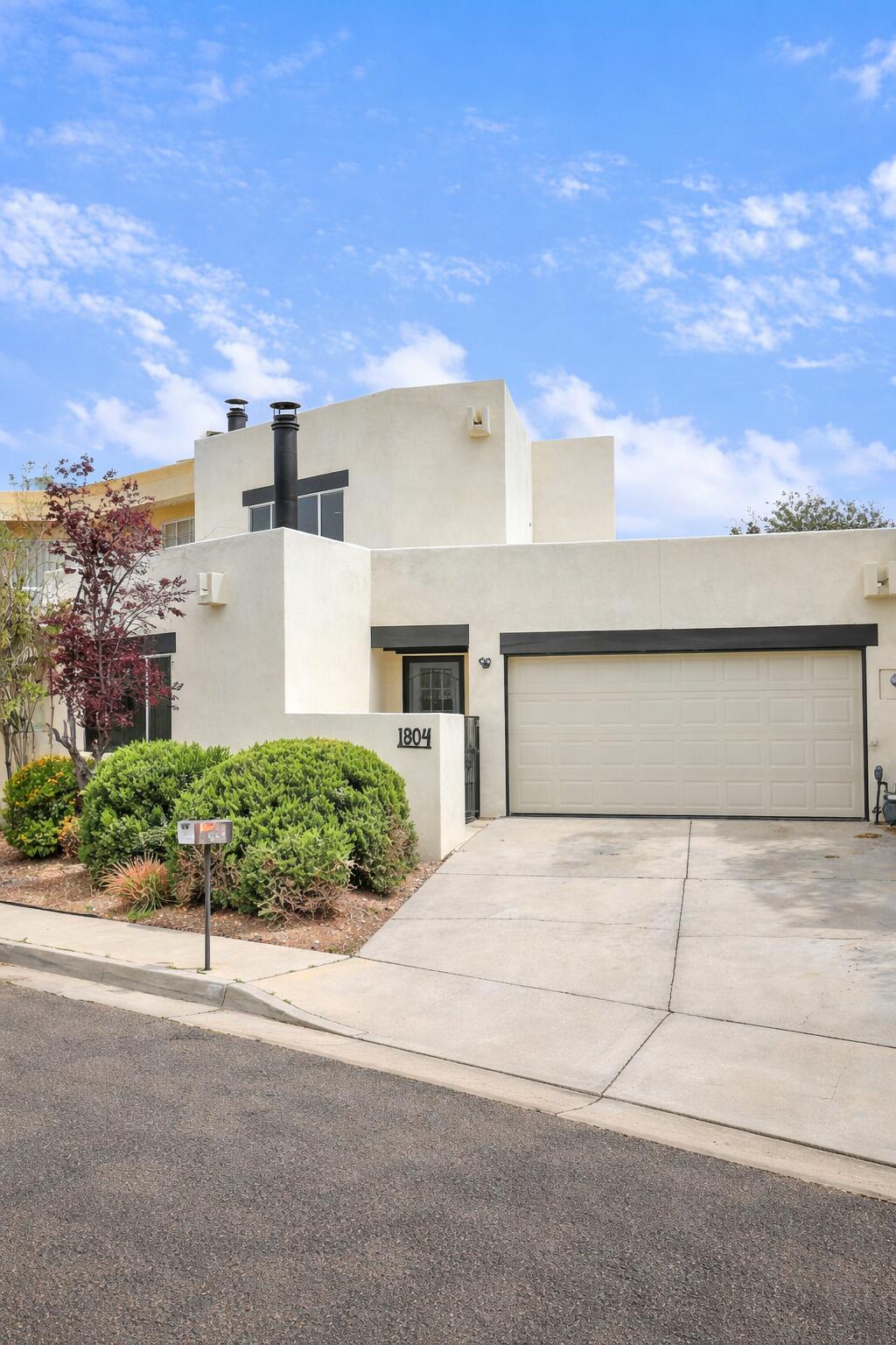 Fully remodeled home in a prime location near UNM and UNM Hospital! This thoughtfully updated property features a rare dual primary suite layout with one bedroom and full bath on each level--perfect for roommates, multigenerational living, or added privacy. Enjoy a brand-new kitchen with modern finishes, updated bathrooms, new flooring, fresh paint, and upgraded systems throughout. Convenient access to I-25, dining, shopping, and medical facilities. Turnkey and move-in ready--ideal for owner-occupants or investors seeking a strong rental opportunity in a high-demand area.