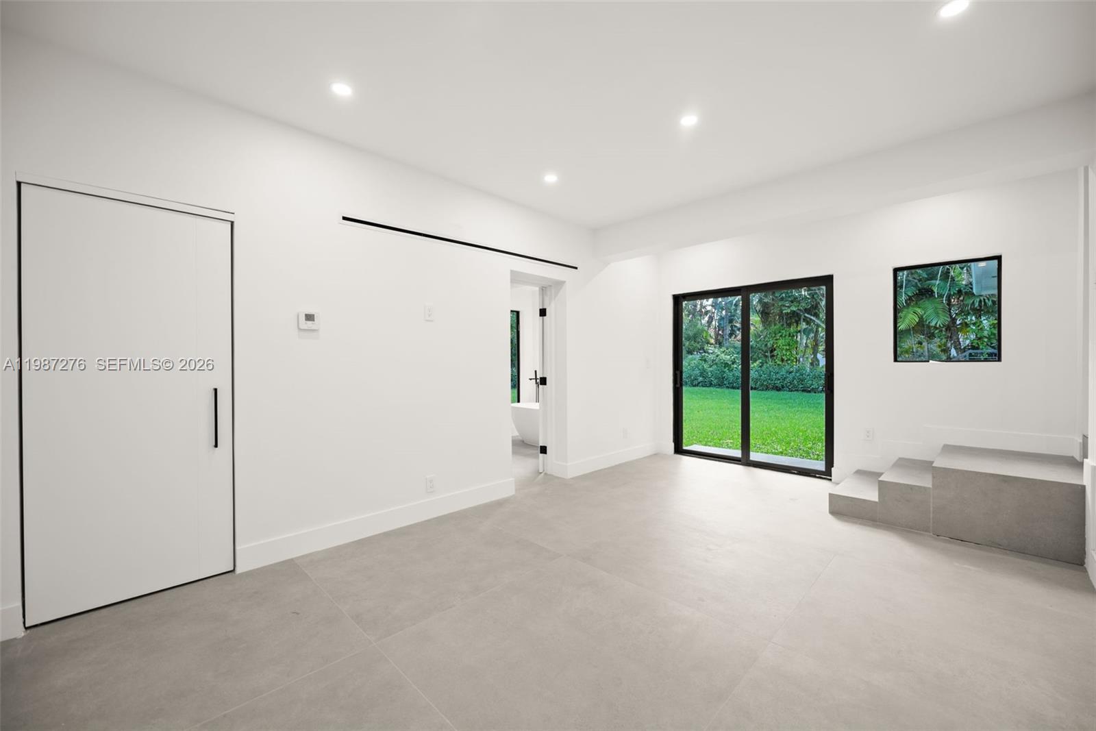 Well-appointed guest bedroom at 235 91st St - Home in Miami Shores