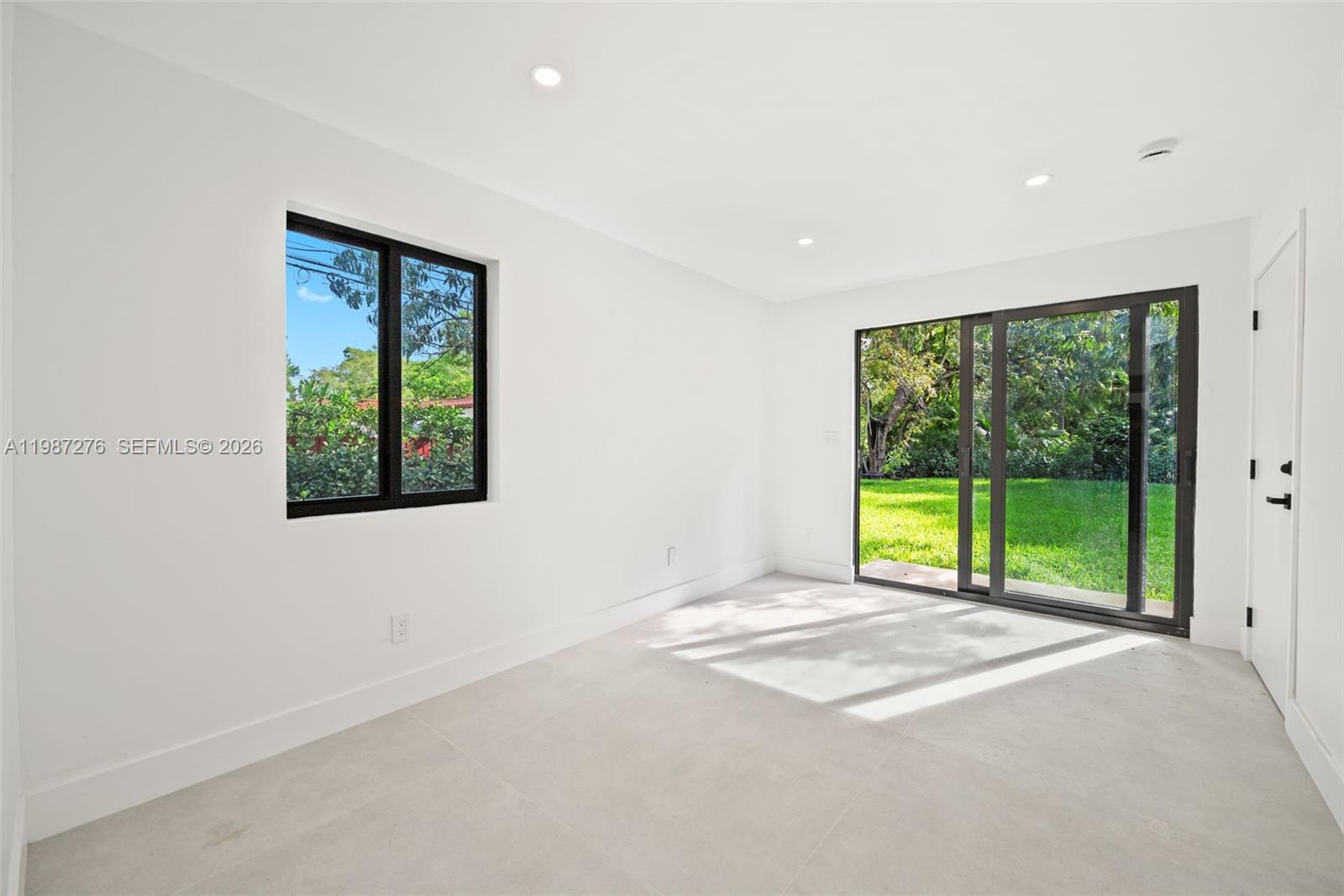 Well-appointed guest bedroom at 235 91st St - Home in Miami Shores