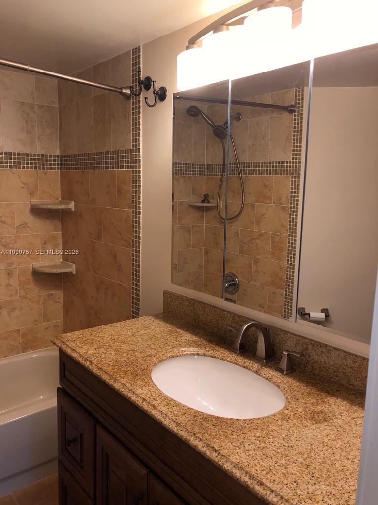 Elegant master bedroom retreat at 215 Lake Pointe Dr - Condo in Oakland Park
