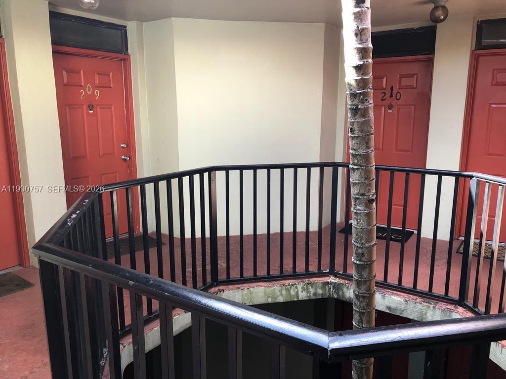 Well-appointed guest bedroom at 215 Lake Pointe Dr - Condo in Oakland Park