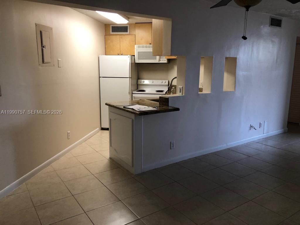 Open-concept living area at 215 Lake Pointe Dr - Condo in Oakland Park