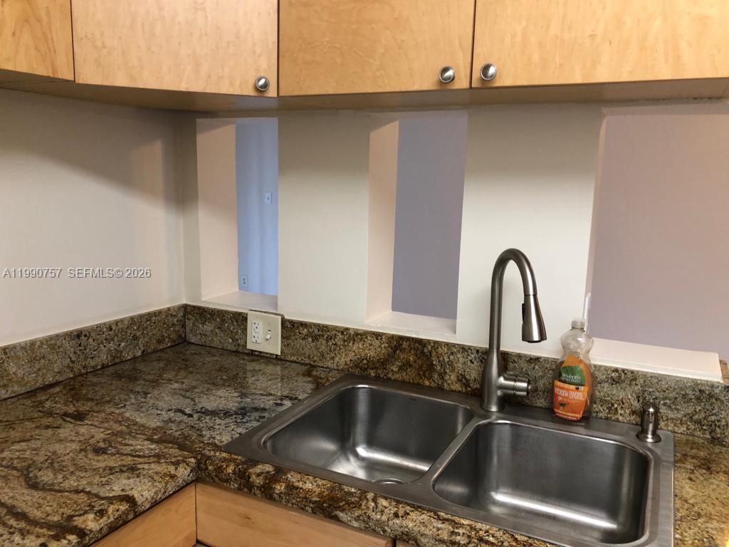 Modern kitchen with designer features at 215 Lake Pointe Dr - Condo in Oakland Park