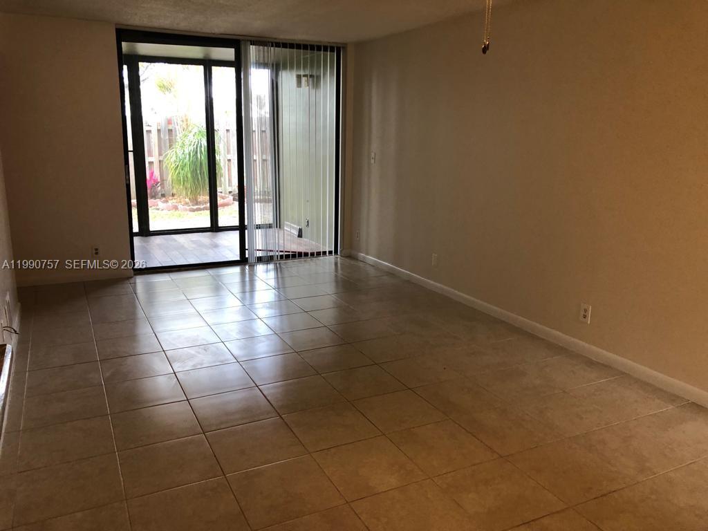 Well-appointed guest bedroom at 215 Lake Pointe Dr - Condo in Oakland Park
