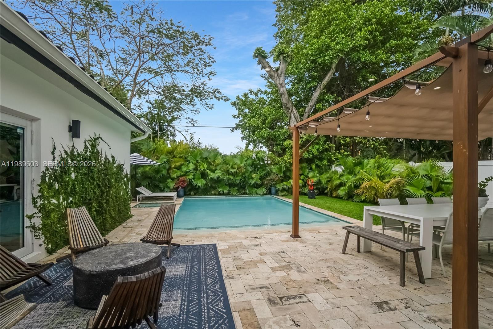 Elegant exterior with pool at 1022 91st Ter - Home in Miami Shores