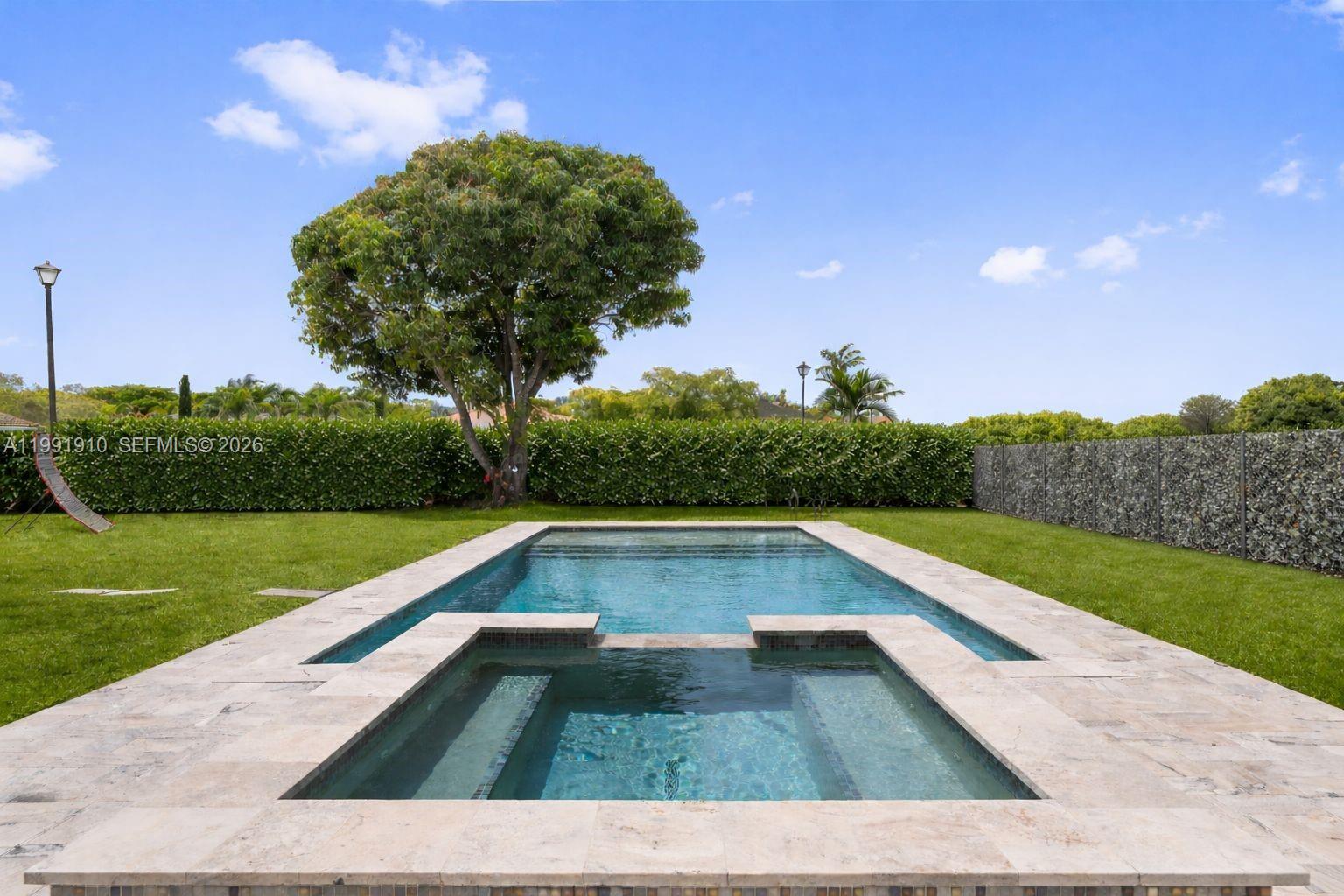 Tucked away in the enchanting enclave of Pelican Bay, just off Old Cutler Road in Cutler Bay, this residence feels like something out of a modern-day fairy tale. From the moment you arrive, the home welcomes you with warmth and elegance, where sunlit living spaces unfold like chapters of a story—each one designed for both grand gatherings and quiet, everyday moments. At the heart of the home, a newly reimagined chef’s kitchen shines like a jewel, adorned with premium appliances and complemented by beautiful new flooring that flows gracefully across the first floor. Every detail has been thoughtfully enhanced—from the convenience of a new washer and dryer to the allure of your own private outdoor retreat. Step outside and discover a lush, tropical escape where a sparkling heated pool and spa shimmer beneath the sun, framed by swaying palms and a charming pergola—perfect for al fresco evenings that feel almost magical. With its flexible layout, the home effortlessly adapts to your story—whether it’s hosting loved ones, creating a serene home office, or welcoming guests. Beyond your gates, the neighborhood adds to the charm: a golf-cart-friendly community with marina access, nearby waterfront dining, and moments from Town Center, expansive parks, and the highly anticipated Legacy Park. This is more than a home—it’s a place where everyday life feels just a little more extraordinary.A Beautiful Miami Home… ready to be yours. Make it Rein!