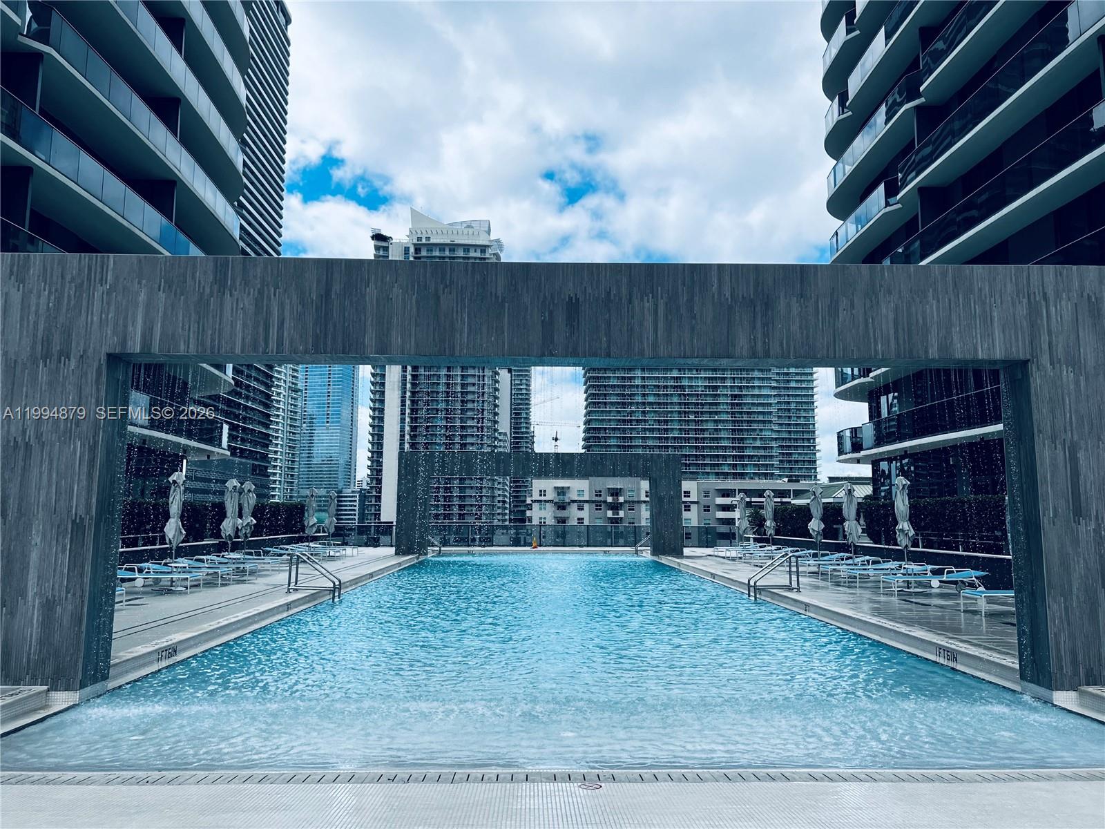 The beautiful high floor unit offers 1 bedroom plus den, 2 bathroom and it comes fully furnished with high-end designer furniture. The den was converted to a second bedroom with Murphy bed and custom closet. The unit has a large balcony with spectacular views of the Brickell Skyline and the bay. The building is located between Brickell City Center and Mary Brickell Village, close to premier dining, shopping and entertainment. You will enjoy the 5 star amenities including roof top pools with sky deck, spa, a kid's play room, a business center, the best Equinox fitness center and more. The unit has a storage and valet parking.