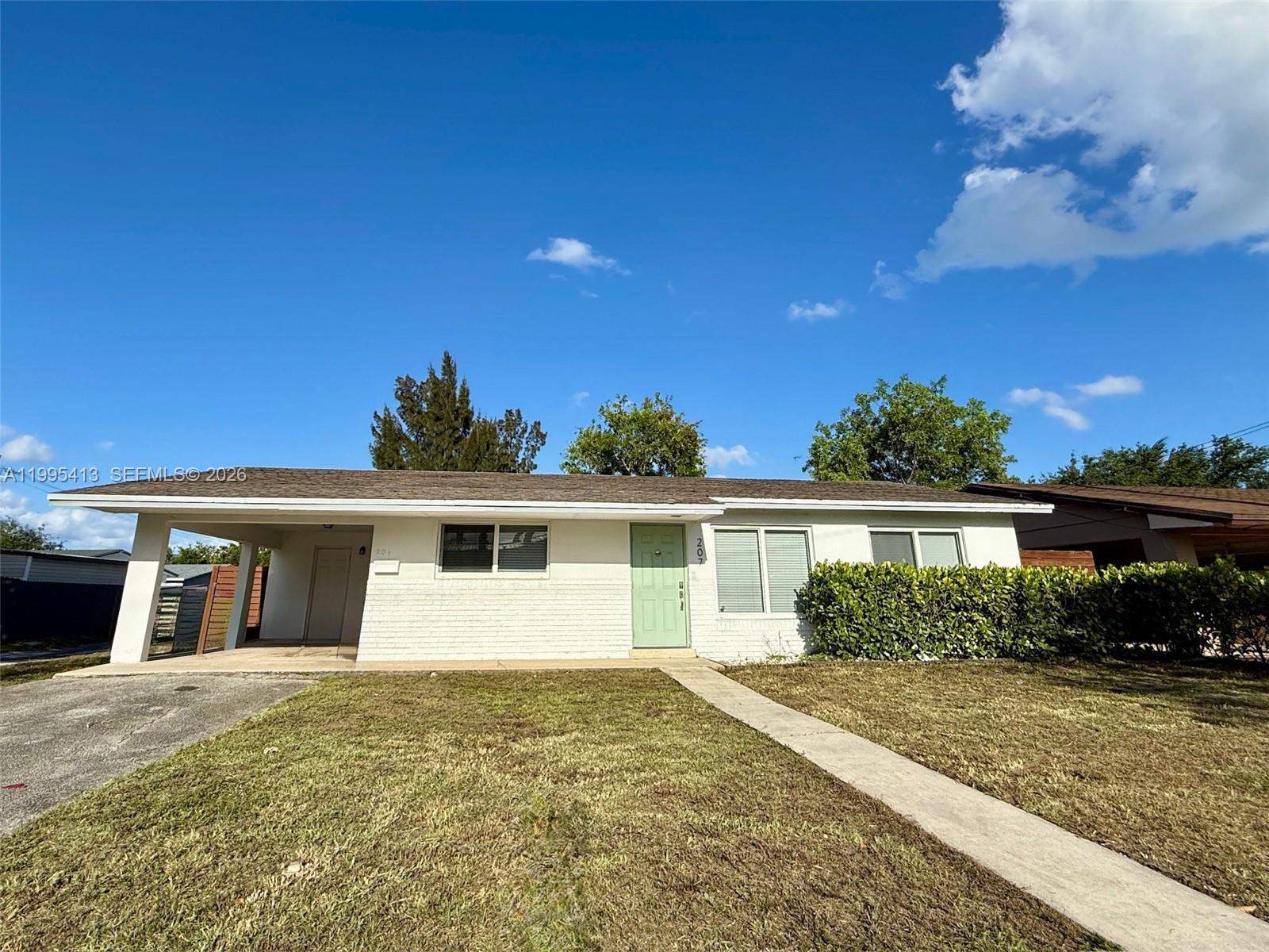 Spacious living room with panoramic views at 207 12th Ave - Home in Dania Beach